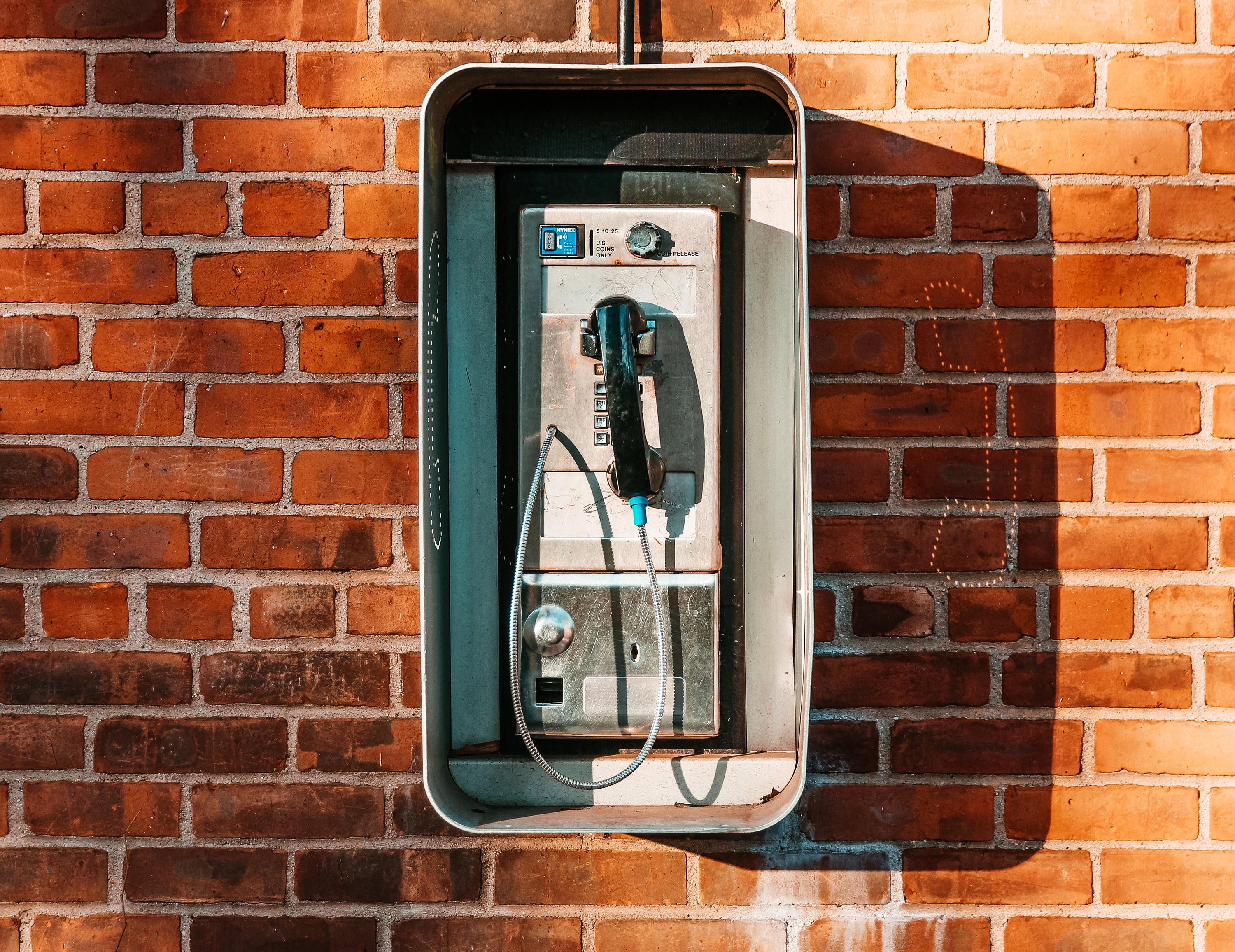 files/payphone-on-brick-wall.jpg